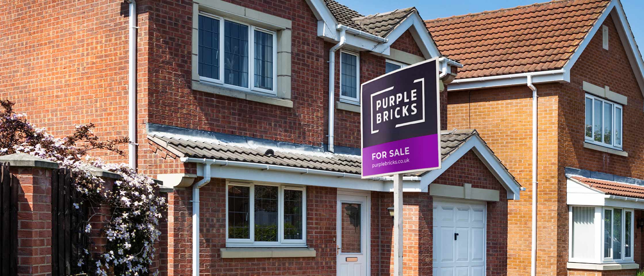 Purplebricks for sale board outside a house
