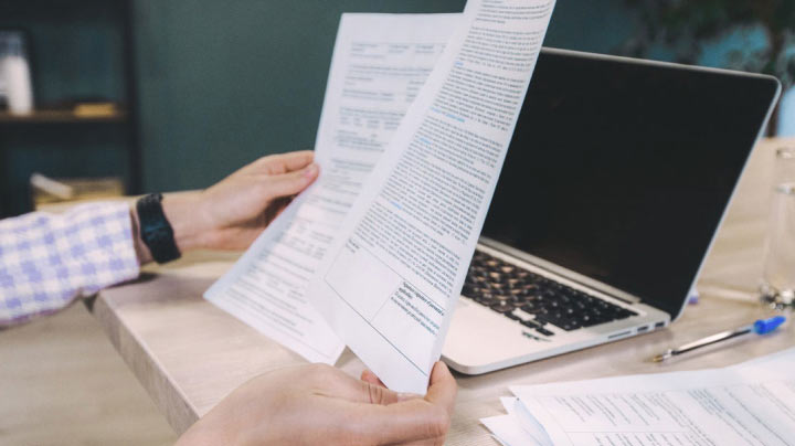 A man reviews conveyancing documents