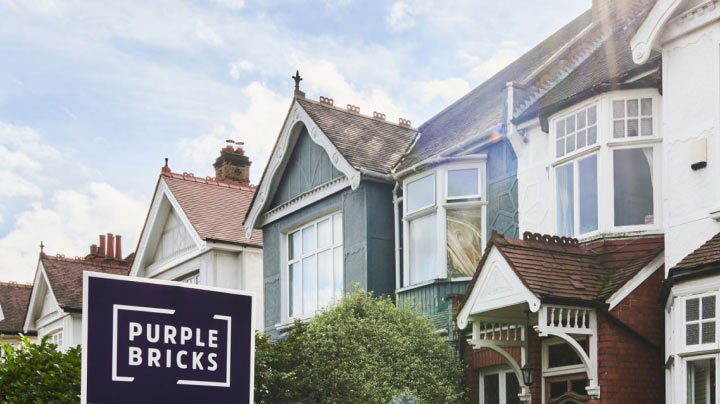 A Purplebricks for sale board outside a property