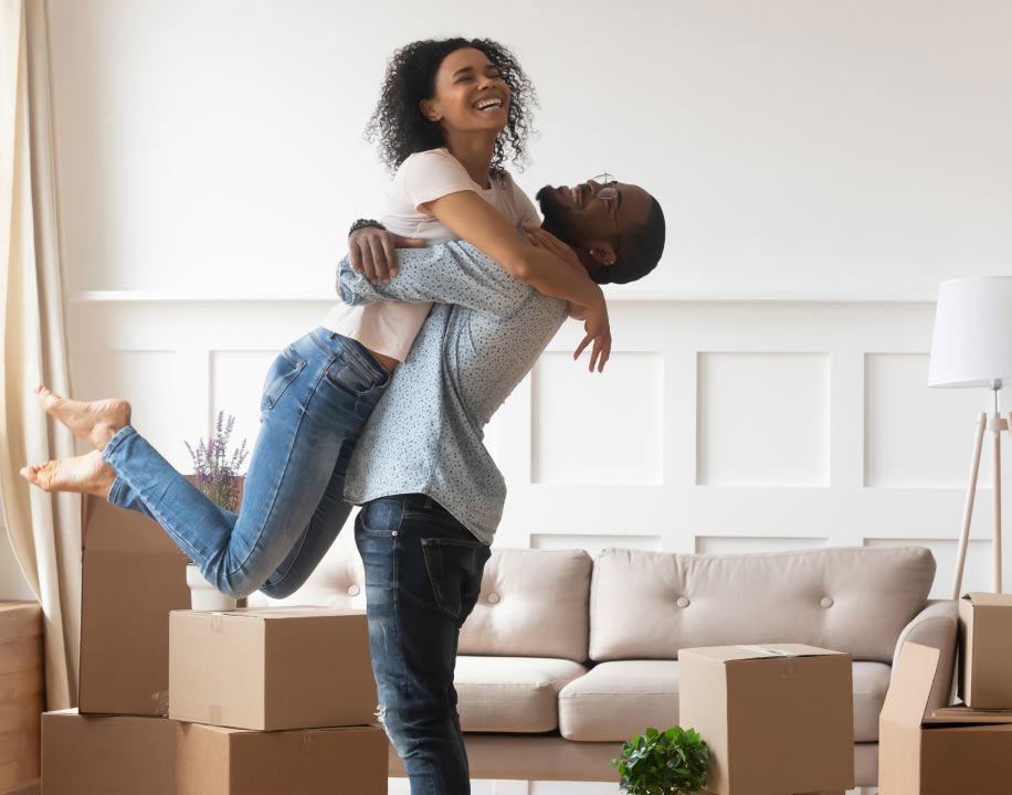 A young couple embracing on their moving day